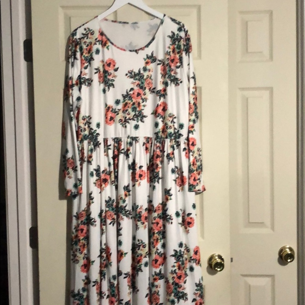 White floral maxi dress with long sleeves.